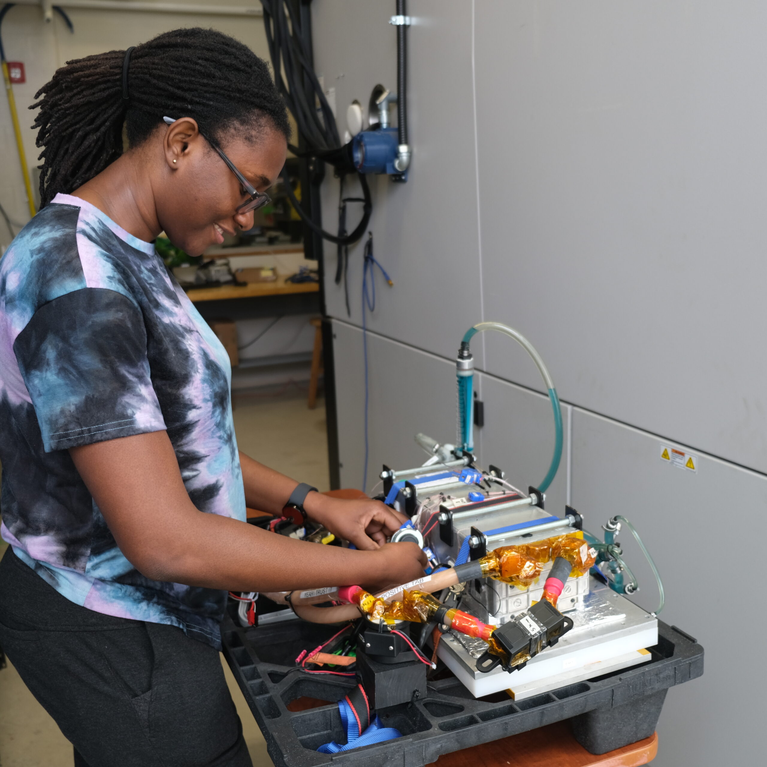 Lucia making sure the connections on her battery pack are still intact, and it is operational. Picture is taken inside the cell testing lab in MARC 130.